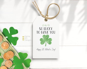 May include: White gift tag with a green shamrock and the text "So lucky to have you. Happy St. Patrick's Day!"