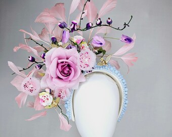 kentucky derby hat fascinator light pink blush pink rose feathers purple flowers leaves and tiny gold flying birds on blue pearl headband