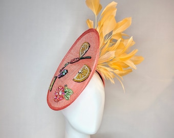 kentucky derby hat fascinator coral sinamay saucer with orange feathers with crystal rhinestone fruit grapes cherry lemon