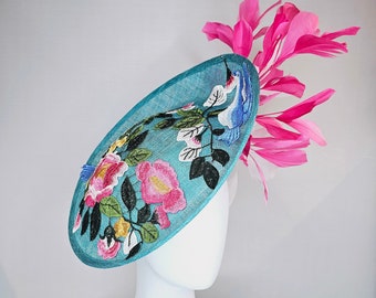 kentucky derby hat fascinator teal blue sinamay saucer with pink and white feathers and pink white blue gold embroidered flowers and birds