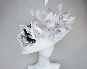 kentucky derby hat fascinator white large oval silk like oval saucer with silver gray feathers with large black white oragnza flower