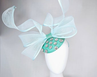 kentucky derby hat fascinator mint green fabric base with mesh and wired ribbon large bendable bow decor with clear  crystal jewels