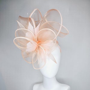 kentucky derby hat fascinator with light blush pink mesh and wired ribbon large bendable decor with light blush pink branching feathers