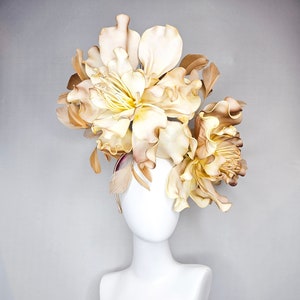 kentucky derby hat fascinator gold feathers and huge beige champagne gold avant garde flowers