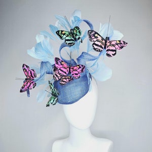 kentucky derby hat fascinator blue sinamay with sinamay curls light blue branching feathers colorful light hot pink green large butterflies