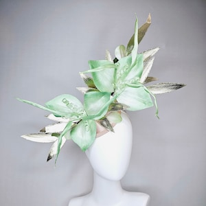 kentucky derby hat fascinator large ombre light green satin flowers with curls and gold metallic leaves on a champagne satin base