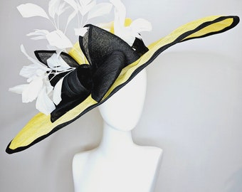 Reserved for shannon kentucky derby hat wide brim oval oblong sinamay in yellow with black sinamay edging and black bow and white feathers