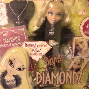 Amazing Cloe Bratz forever Diamondz Doll with her black fur and top says &quot;Angel&quot; rhinestones on heels, jeans, belt, bracelet, earring