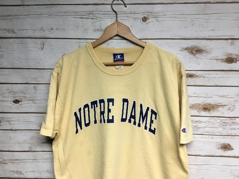 beige champion shirt