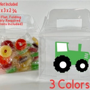 May include: Clear plastic favor boxes with a green tractor design. The boxes are 4 inches by 3 inches by 2 3/4 inches and come in 3 colors. Candy not included.