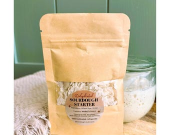May include: A tan, resealable pouch containing dehydrated sourdough starter. The label reads: Dehydrated SOURDOUGH STARTER, Ingredients: Wheat flour, Water, Contains: WHEAT (Gluten), Store in a cool, dry place, Best before 6 months from purchase, Once activated, refrigerate.