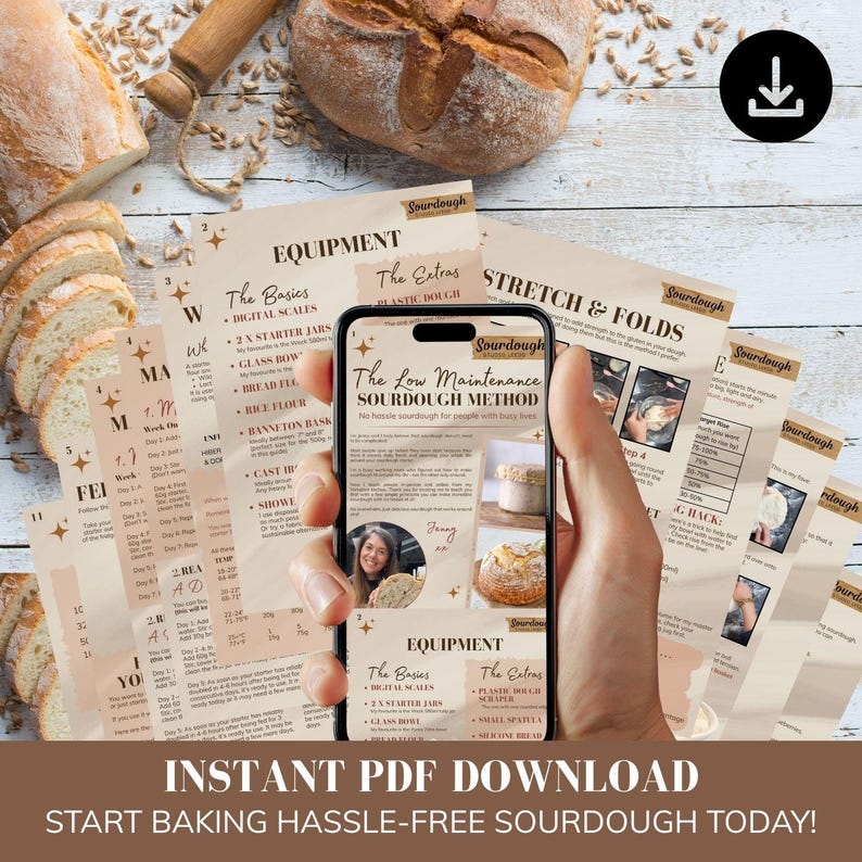 May include: A smartphone displaying a digital guide titled The Low Maintenance Sourdough Method, held over a stack of printed instructional pages about sourdough baking, surrounded by fresh bread loaves and scattered grains on a wooden surface.