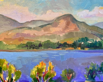 May include: An oil painting depicts a landscape with a lake, mountains, and trees. The water is a deep blue, reflecting the sky. The mountains are a mix of greens and browns, and the trees are a mix of greens and yellows. The sky is a light blue with some clouds.