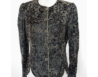 May include: A black velvet blazer with a gold floral pattern. The blazer has a button-up front and long sleeves.