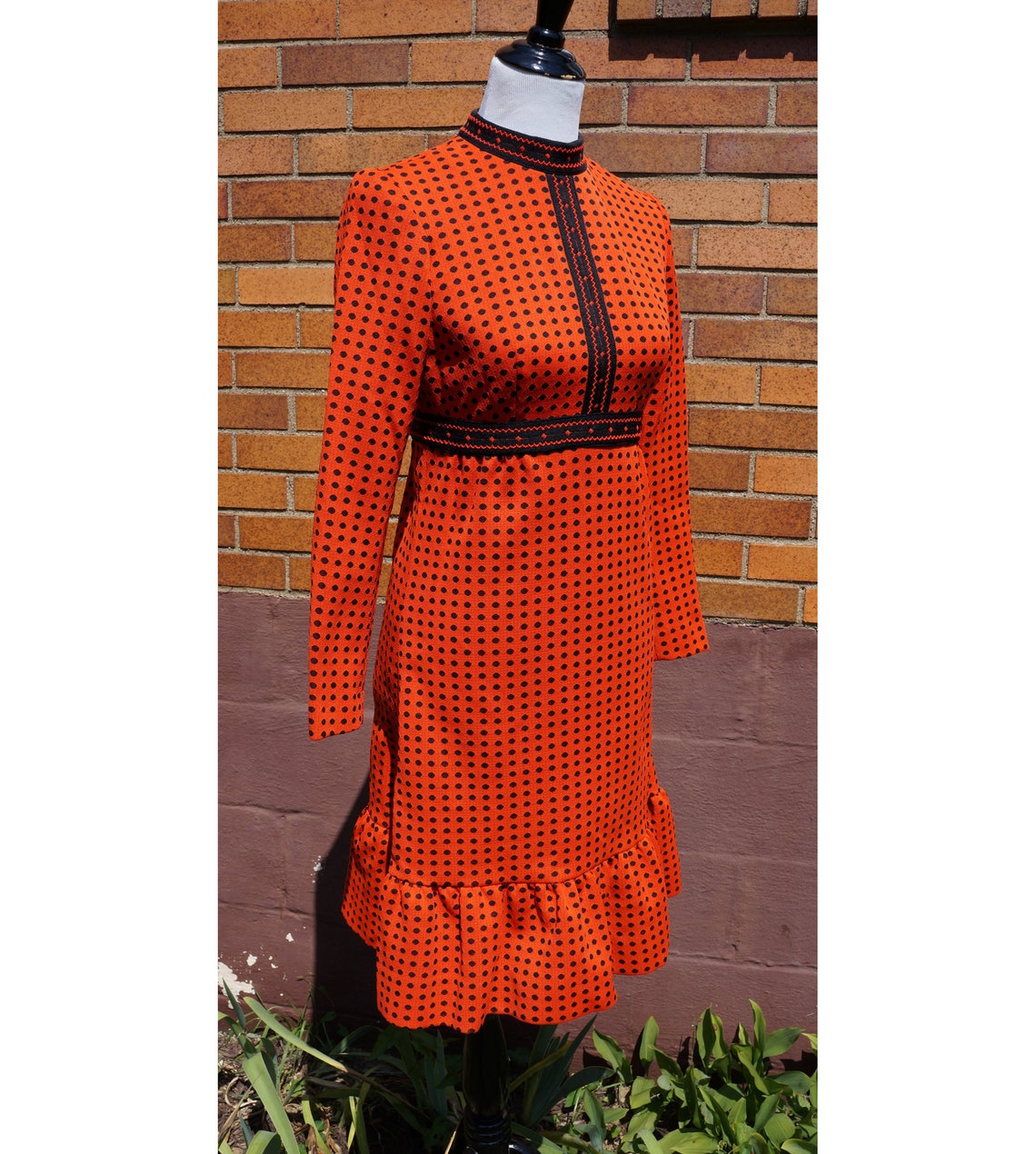 orange dress with black polka dots