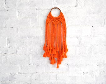 Orange macrame wall hanging