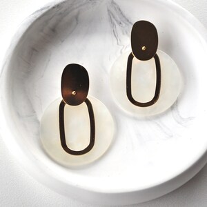White and gold earrings