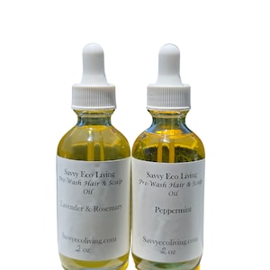 May include: Two glass bottles of Savvy Eco Living Pre-Wash Hair & Scalp Oil. One bottle is labeled "Lavender & Rosemary", the other "Peppermint". Each bottle contains 2 oz of oil and has a white dropper top.