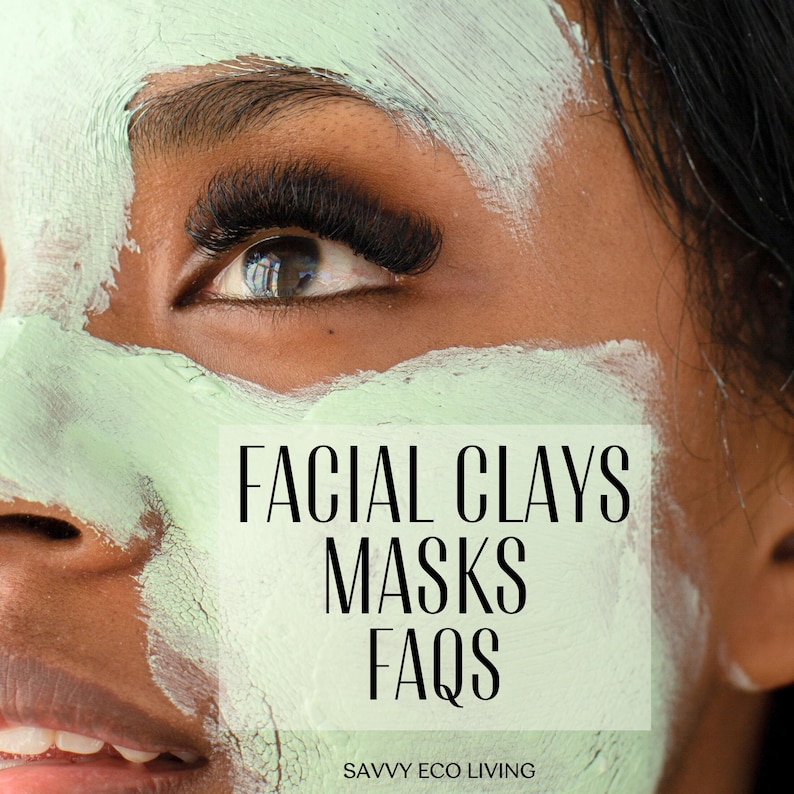 May include: A face covered in a light green clay mask with the text FACIAL CLAYS MASKS FAQS and SAVVY ECO LIVING printed in black. The skin has a smooth texture, and the eyes feature long, dark, voluminous eyelashes visible above the mask.