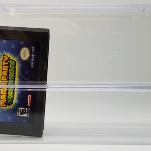 May include: A clear plastic case with a black Game Boy Advance game cartridge inside. The game cartridge is for "Mario Party Advance" and has a blue, green, and yellow design. The game cartridge has a rating of "E" for Everyone.