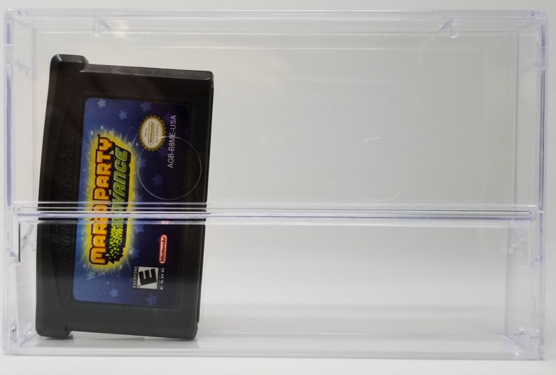 May include: A clear plastic case with a black Game Boy Advance game cartridge inside. The game cartridge is for "Mario Party Advance" and has a blue, green, and yellow design. The game cartridge has a rating of "E" for Everyone.