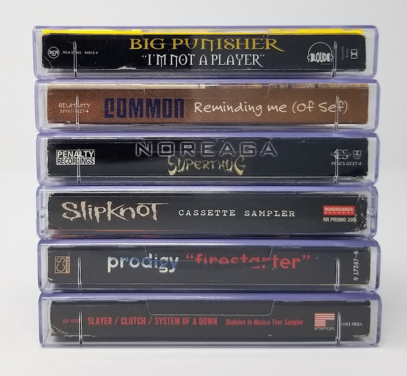 May include: A stack of six cassette tapes, including Big Punisher "I'm Not A Player", Common "Reminding Me (Of Self)", Noreaga "Superthug", Slipknot "Cassette Sampler", Prodigy "Firestarter", and Slayer/Clutch/System Of A Down "Diabolus In Musica Tour Sampler".