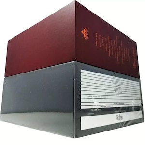 May include: A two-tiered box set of The Beatles albums. The top box is burgundy with gold lettering and the bottom box is black with white lettering. The text on the box reads "The Beatles" and "Let It Be".