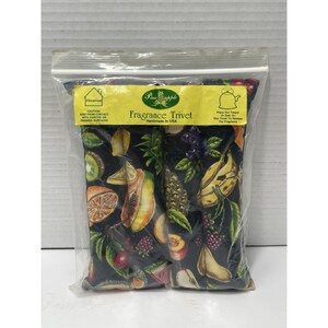 May include: A rectangular fragrance trivet in a clear plastic bag with a yellow label reading "Pineapple Fragrance Trivet Handmade in USA". The fabric features a black background with a colorful print of various fruits including bananas, berries, and citrus.