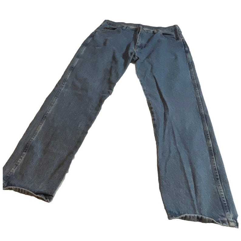 May include: A pair of light blue denim jeans. The jeans have a classic five-pocket design, a button and zipper closure, and a straight leg fit. The denim has a slightly faded appearance.