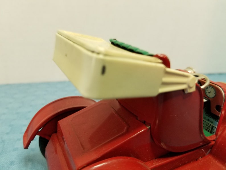 Vintage old-time tin litho toy car