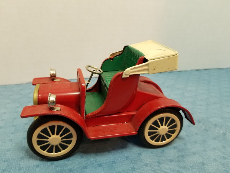 Vintage old-time tin litho toy car