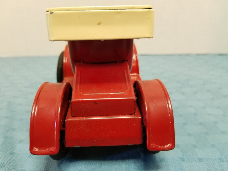 Vintage old-time tin litho toy car