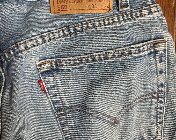 Vintage Levi’s 550 Relaxed Fit Jeans W33 L34 Light Wash Distressed Cut Hem 90s