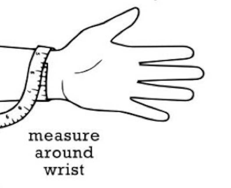 May include: A diagram showing how to measure your wrist for a bracelet. A tape measure is wrapped around the wrist, just below the wrist bone.