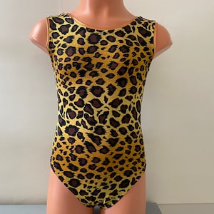 May include: A sleeveless leotard with a leopard print pattern in shades of brown and yellow.