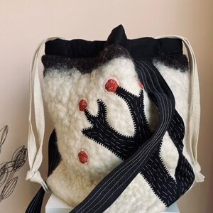 Wollen tas store