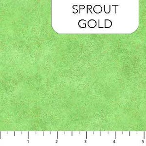 May include: Close-up of a green fabric with a textured pattern. The fabric has a light green hue with darker green accents. The text "SPROUT GOLD" is displayed in a white rectangular box. A ruler is at the bottom, showing measurements in inches.