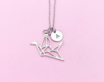 May include: Silver origami crane necklace with a small silver disc charm engraved with the letter "A".