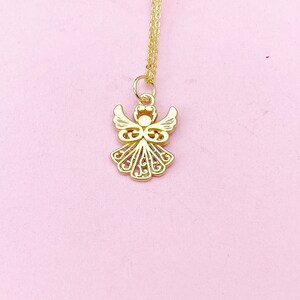 May include: A gold chain necklace with a delicate angel pendant. The angel is intricately designed with a filigree pattern.