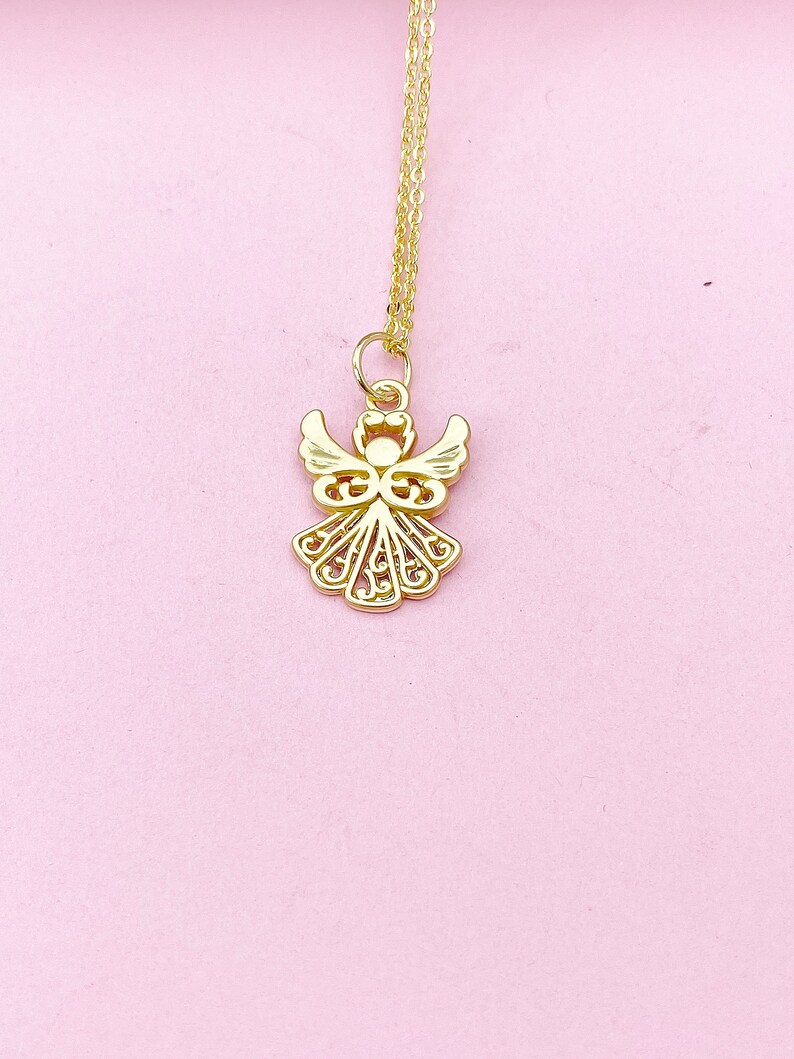 May include: A gold chain necklace with a delicate angel pendant. The angel is intricately designed with a filigree pattern.
