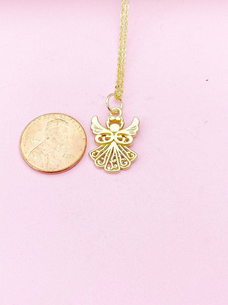 May include: A gold angel pendant necklace with a delicate chain. The pendant is about the size of a US penny.