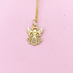 May include: A gold chain necklace with a delicate angel pendant. The angel is intricately designed with a filigree pattern.
