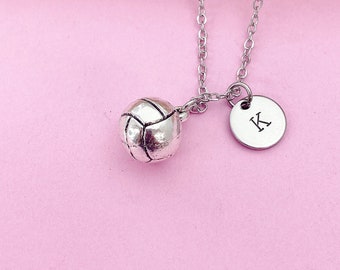 May include: Silver necklace with a volleyball charm and a circular charm with the letter K.
