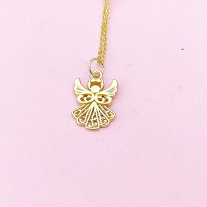 May include: A gold angel pendant necklace with a delicate, intricate design. The pendant is suspended from a thin gold chain.