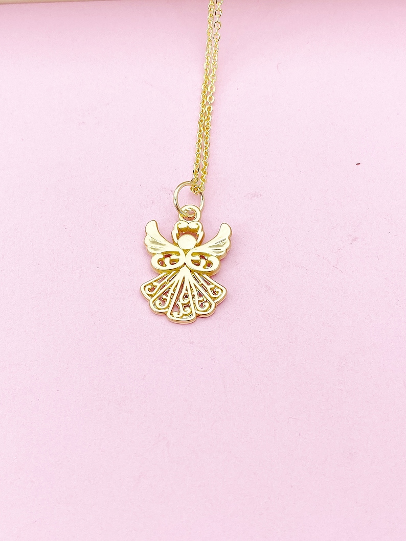 May include: A gold angel pendant necklace with a delicate, intricate design. The pendant is suspended from a thin gold chain.
