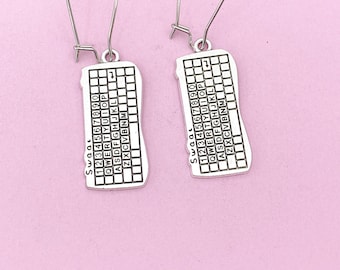 May include: A pair of silver earrings shaped like a computer keyboard. The earrings have a silver hook and the keyboard has the numbers 1234567890, the letters QWERTYUIOP, ASDFGHJKL, ZXCVBNM, and the word "SWOOL" printed on them.