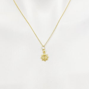 Gold Sun With Bell Necklace N5184A