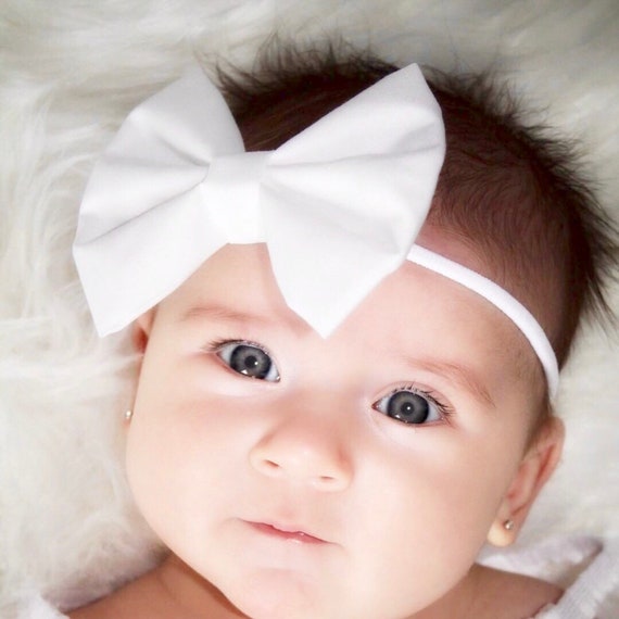 baby with bow on head