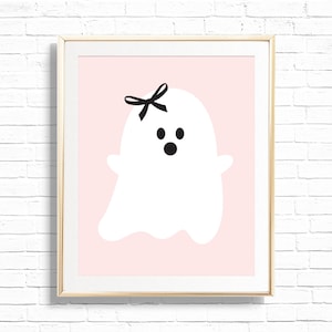 May include: A white ghost with a black bow on its head and black eyes and mouth on a pink background.