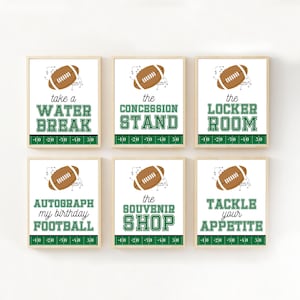 May include: Six framed signs with football themes. Each sign features a football graphic and text in green and white. The text includes phrases like "Water Break," "Concession Stand," and "Locker Room."